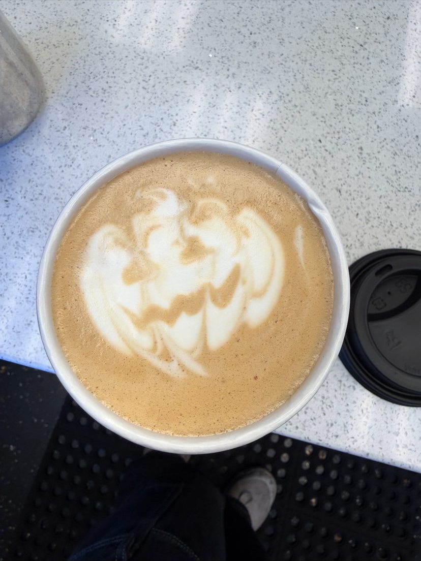 Latte with jack-o’-lantern latte art